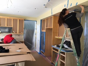 Working on painting kitchen cabinets